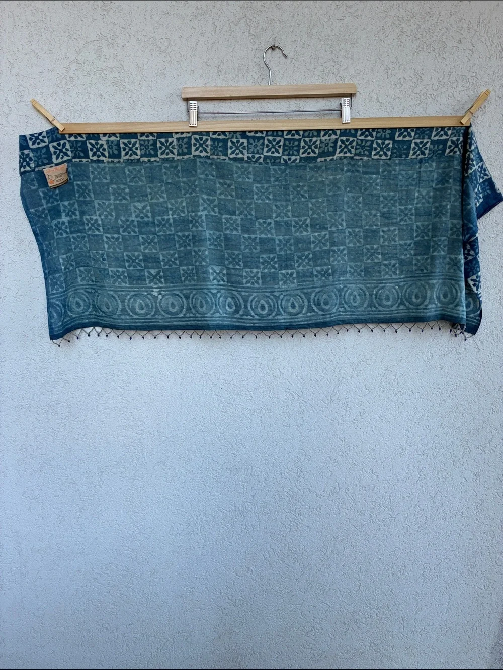 Blue & white  batik patterned short curtain or valance with beaded trim.